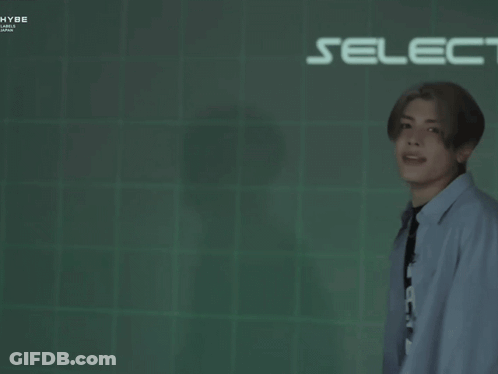 Man Standing In Front Of Select Game Screen GIF