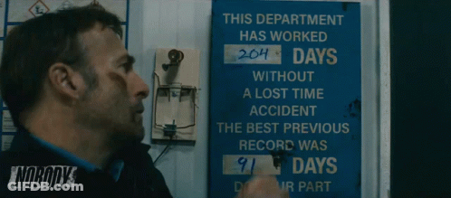 Man Standing In Front Of Sign This Department Has Worked 204 Days GIF