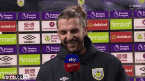 Man Standing In Front Of Sky Sports Ads GIF