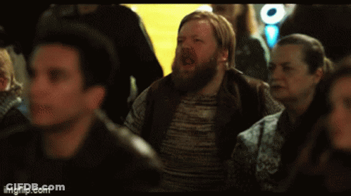 Man Standing In Front Of Sonia Banner GIF