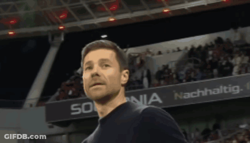 Man Standing In Front Of Sonia Banner GIF