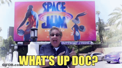 Man Standing In Front Of Space Jam Billboard GIF