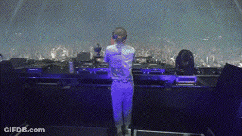 Man Standing In Front Of Stage With Microphone GIF