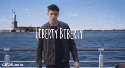 Man Standing In Front Of Statue Of Liberty Saying Liberty Biberty GIF