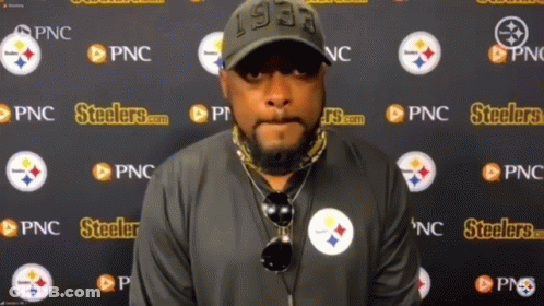 Man Standing In Front Of Steelers Wall GIF