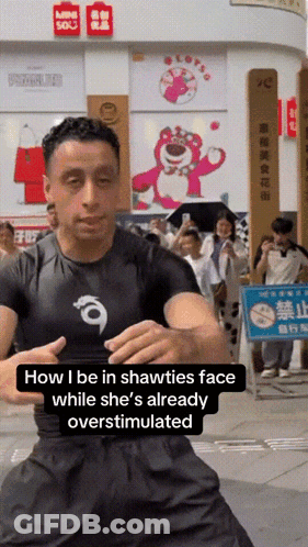 Man Standing In Front Of Store With Mini Sox Sign GIF