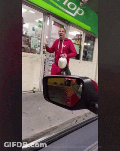 Man Standing In Front Of Store With Top GIF