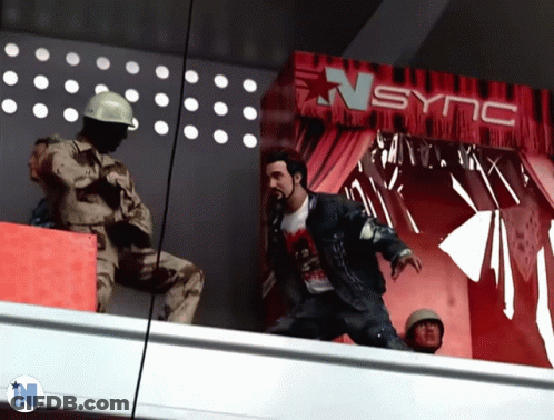 Man Standing In Front Of Sync Sign GIF