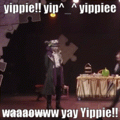 Man Standing In Front Of Table Saying Yippie GIF