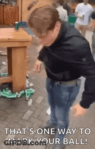 Man Standing In Front Of Table With Soda Can GIF