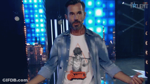 Man Standing In Front Of Talent Screen GIF