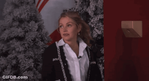 Man Standing In Front Of Talent Sign GIF