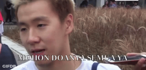 Man Standing In Front Of Tall Grass GIF