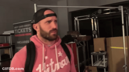 Man Standing In Front Of Tickets Sign GIF