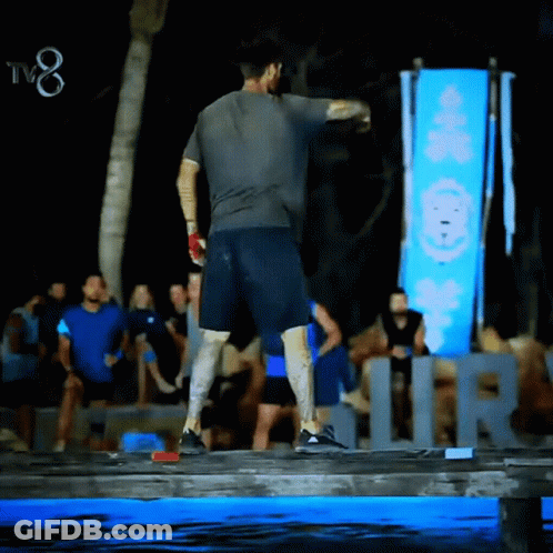 Man Standing In Front Of TV8 Sign GIF