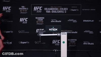 Man Standing In Front Of UFC 333 Sign GIF