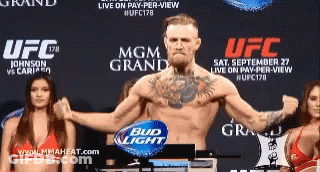 Man Standing In Front Of UFC Sign GIF