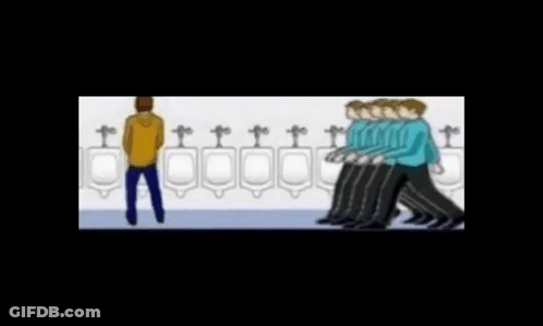 Man Standing In Front Of Urinal GIF