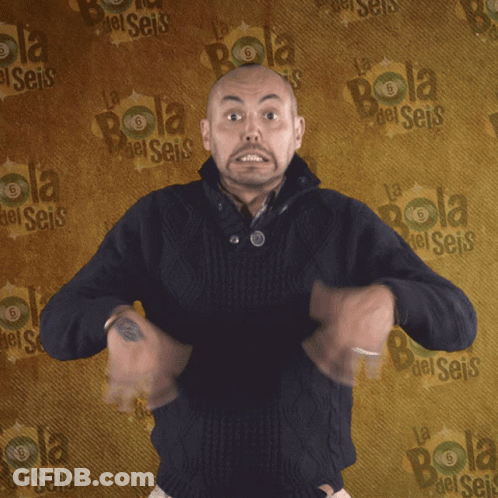 Man Standing In Front Of Wall Saying Bola GIF