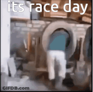 Man Standing In Front Of Washing Machine With Race Day GIF