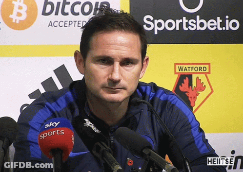 Man Standing In Front Of Watford Sign GIF