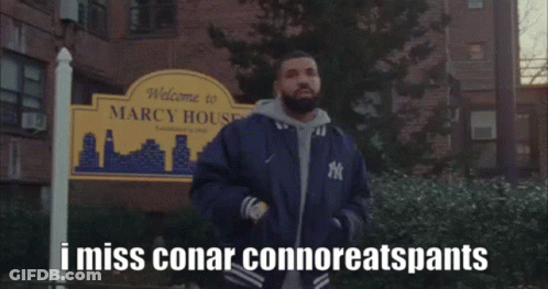 Man Standing In Front Of Welcome To Marcy House Sign GIF