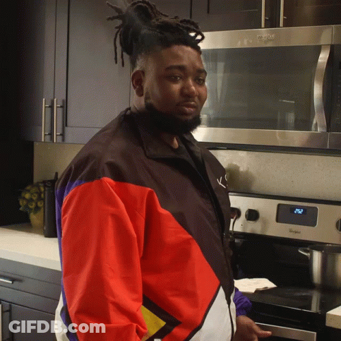 Man Standing In Front Of Whirlpool Stove GIF