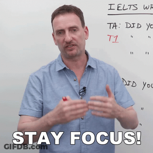 Man Standing In Front Of Whiteboard Saying Stay Focus GIF