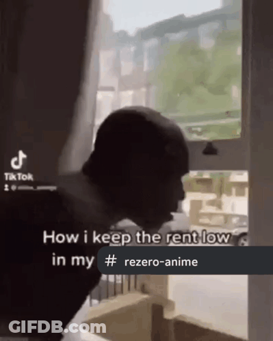 Man Standing In Front Of Window With Caption How I Keep Rent Low GIF