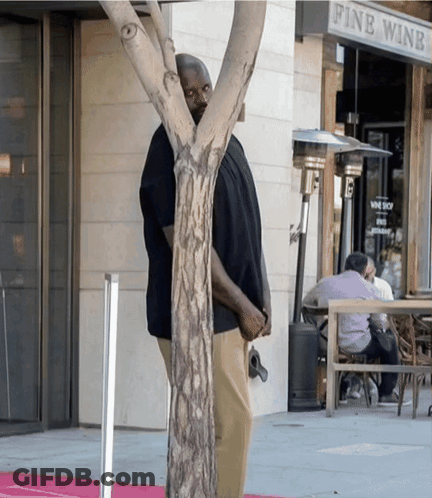 Man Standing In Front Of Wine Shop GIF