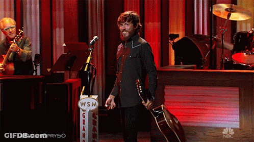 Man Standing In Front Of WSM Sign GIF