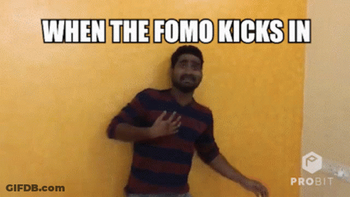 Man Standing In Front Of Yellow Wall When Fomo Kicks In GIF
