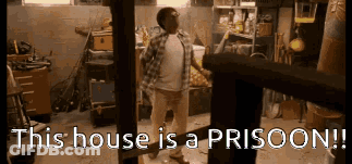Man Standing In Garage With Prison Sign GIF