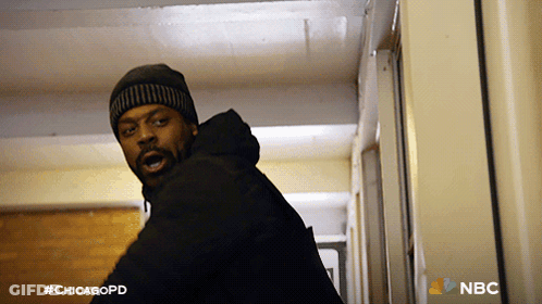 Man Standing In Hallway With #Chicagopd GIF