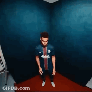 Man Standing In Room With Blue Wall And Red Rug GIF