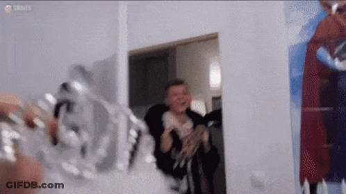 Man Standing In Room With Painting GIF