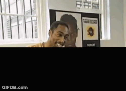 Man Standing In Room With Picture On Wall GIF