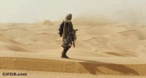 Man Standing In Sandy Desert GIF