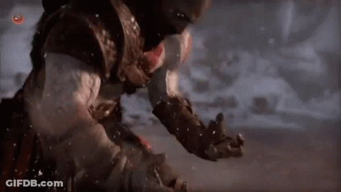 Man Standing In Snow Holding Sword GIF