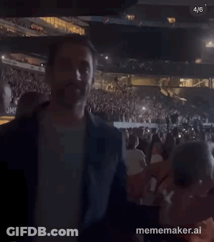 Man Standing In Stadium Crowd GIF