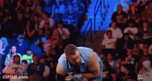 Man Standing In Wrestling Ring Facing Crowd GIF