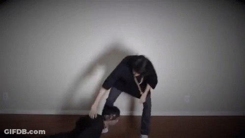 Man Standing Next To Another Man GIF