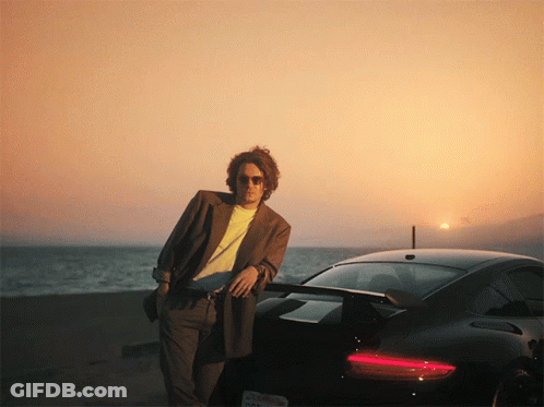 Man Standing Next To Black Sports Car California License Plate GIF