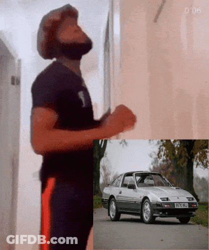 Man Standing Next To Car With License Plate B570WJ GIF