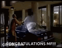 Man Standing Next To Car With Trunk Open Saying Congratulations MF GIF