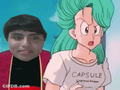 Man Standing Next To Cartoon In Capsule Corporation T-Shirt GIF