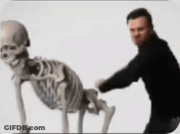 Man Standing Next To Crawling Skeleton GIF