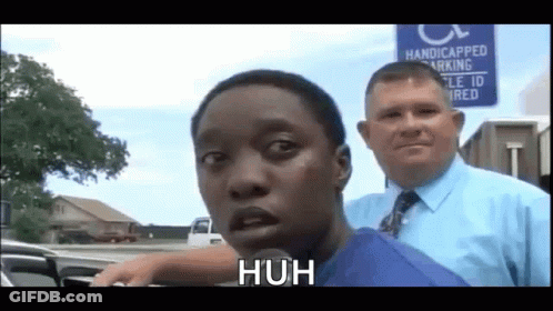 Man Standing Next To Handicapped Parking Sign GIF
