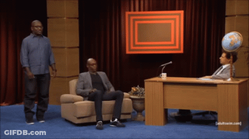 Man Standing Next To Man Sitting With Globe Adult Swim.com GIF