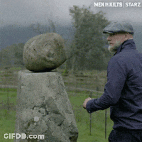 Man Standing Next To Men In Kilts Starz Rock GIF